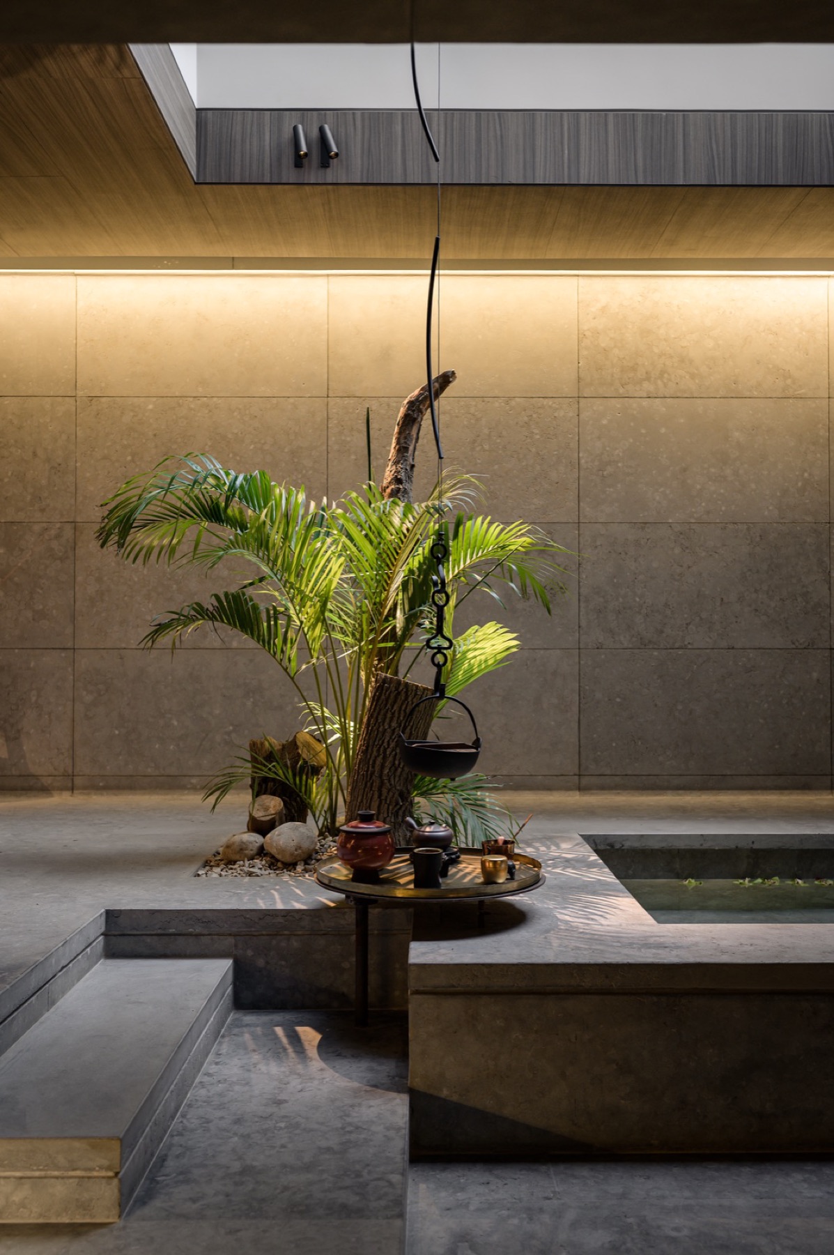 An Analogue interior: stone, water and low light