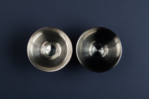 Two Meteorite bowls seen from above, steel and blackened